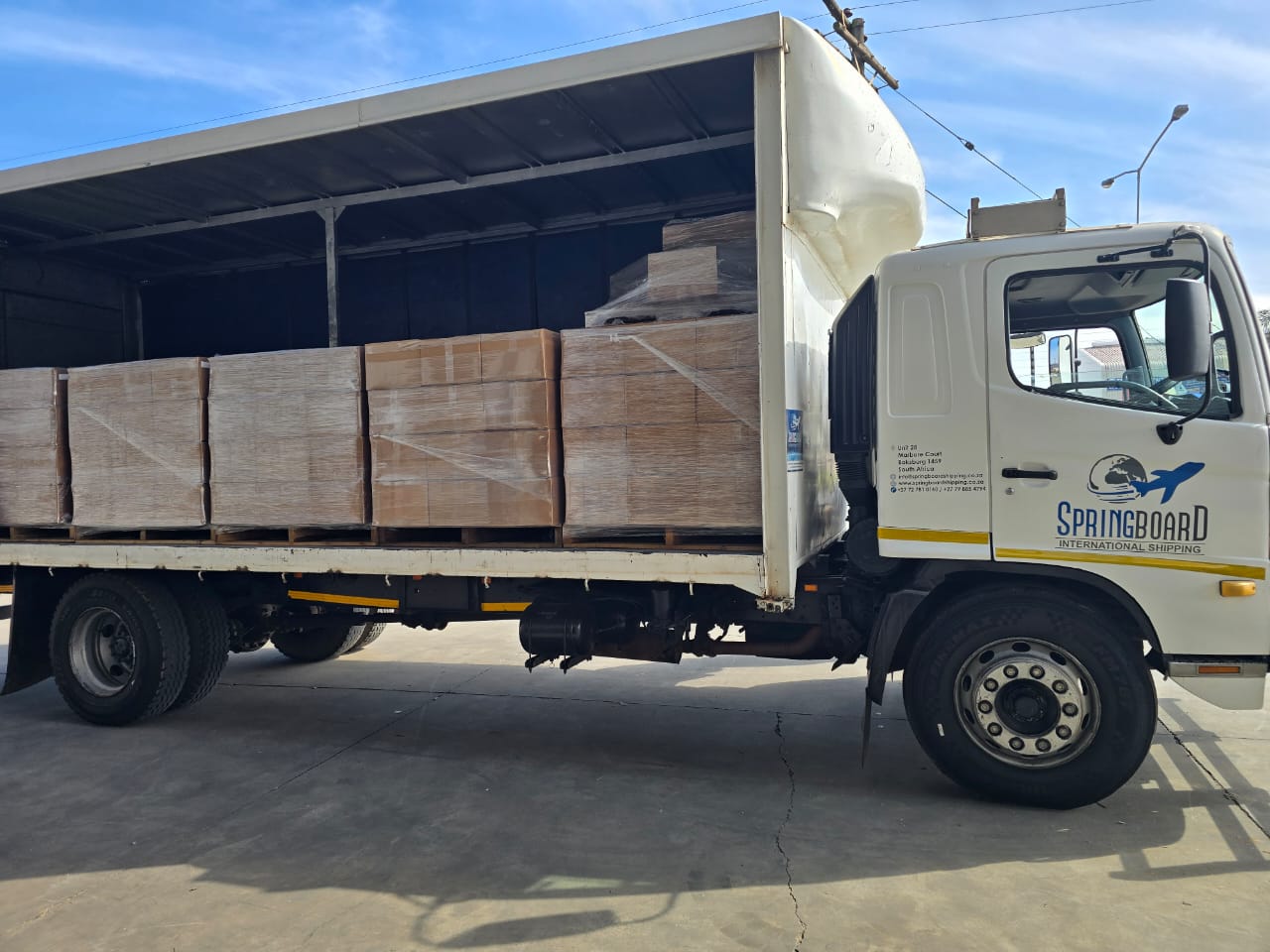 Springboard truck carrying a full dedicated load of palletised cargo
